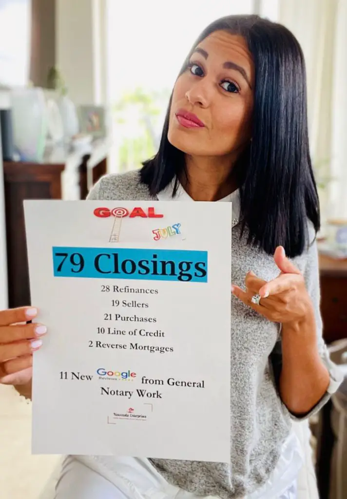 Luisa Cook Notary Public and Loan Signing Agent holding sign with successful notary business results